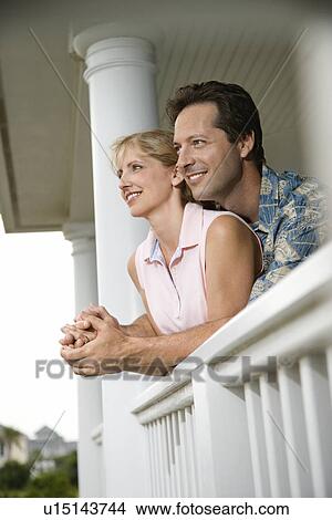 Happy Couple on Porch of Home View Large Photo Image Picture - Happy Couple on Porch of Home. Fotosearch