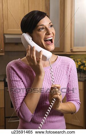 Happy woman talking on phone View Large Photo Image Stock Photography - Happy woman talking on phone. Fotosearch