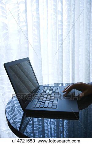 Stock Image - Laptop with Hand. Fotosearch