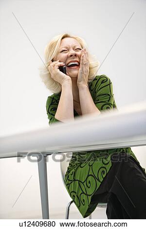 Stock Image - Laughing businesswoman. Fotosearch
