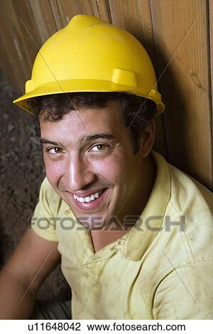 Stock Image - Male Construction Worker Resting. Fotosearch