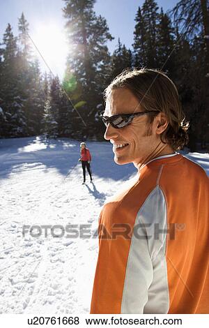 Man and Woman Snow Skiing View Large Photo Image Stock Photo - Man and Woman Snow Skiing. Fotosearch
