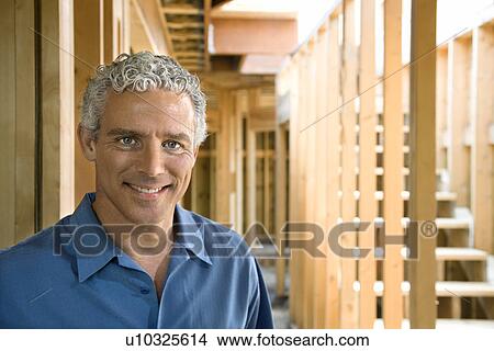 Picture - Man At Construction Site. Fotosearch