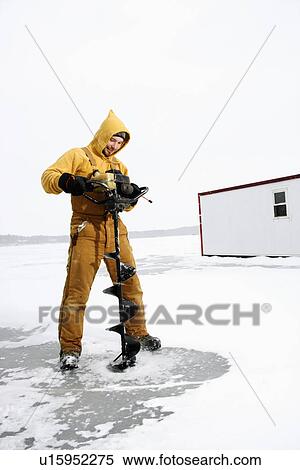 Man Drilling Hole in Ice View Large Photo Image Stock Photography - Man Drilling Hole in Ice. Fotosearch