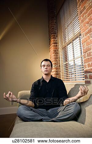 Man in lotus pose View Large Photo Image Stock Image - Man in lotus pose. Fotosearch