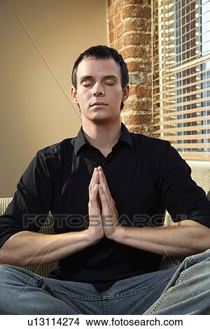 Picture - Man in meditation pose. Fotosearch