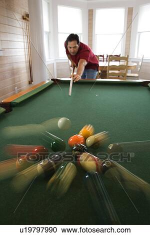 Stock Image - Man Playing Pool. Fotosearch