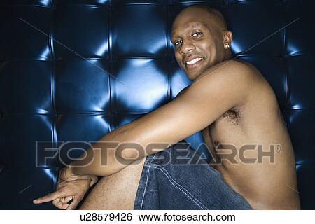 Stock Photograph - Man Shirtless and Smiling. Fotosearch