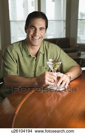 Picture - Man Sitting at Bar. Fotosearch