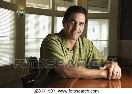 Stock Photo - Man Sitting at Bar. Fotosearch