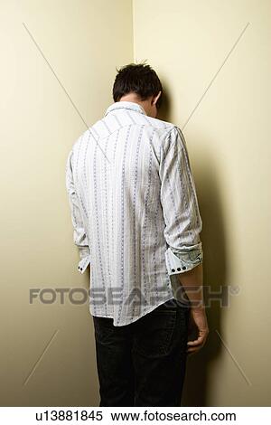 Man standing in corner View Large Photo Image Stock Photography - Man standing in corner. Fotosearch