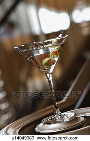 Martini With Olives on Banister View Large Photo Image Stock Photo - Martini With Olives on Banister. Fotosearch