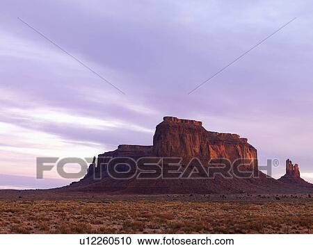 Stock Image - Mesa in Monument Valley at Dusk. Fotosearch