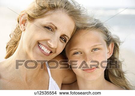 Picture - Mother and Daughter at the Beach. Fotosearch
