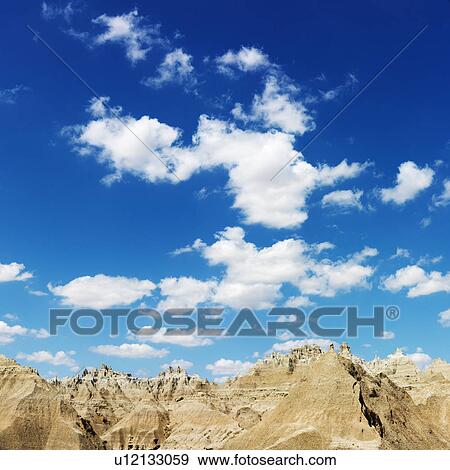 Mountains and Blue Sky in the South Dakota Badlands View Large Photo Image Stock Photo - Mountains and Blue Sky in the South Dakota Badlands. Fotosearch