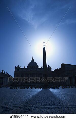 Stock Image - Obelisk in St Peters Square Backlit by the Sun. Fotosearch
