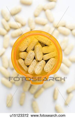 Stock Image - Open Pill Bottle with Tablets. Fotosearch