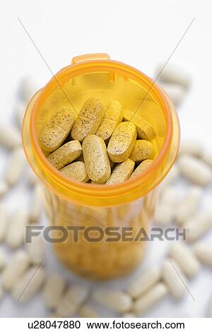 Stock Image - Open Pill Bottle with Tablets. Fotosearch