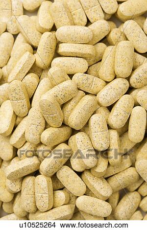 Picture - Pile of Brown Caplets. Fotosearch
