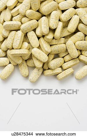 Picture - Pile of Brown Caplets. Fotosearch