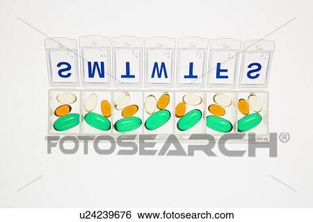 Stock Photograph - Pills in Open Pill Organizer. Fotosearch