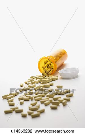 Stock Image - Pills Spilling From Bottle. Fotosearch