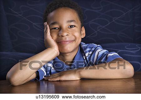 Stock Photo - Portrait of Smiling Young Boy. Fotosearch