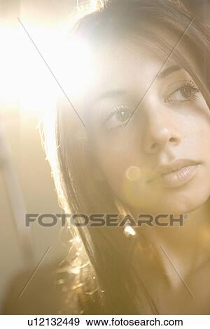 Stock Photo - Pretty young brunette woman. Fotosearch