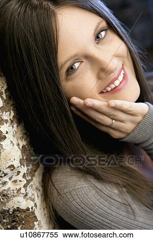 Stock Photography - Pretty young smiling woman. Fotosearch