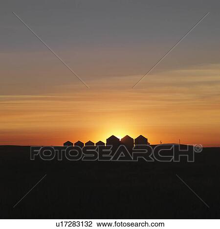 Row of Houses Silhouetted at Sunset View Large Photo Image Stock Image - Row of Houses Silhouetted at Sunset. Fotosearch