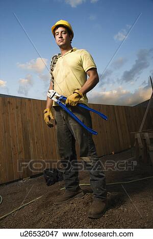 Serious Looking Construction Worker View Large Photo Image Stock Photo - Serious Looking Construction Worker. Fotosearch