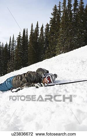 Skier Lying in Snow View Large Photo Image Stock Image - Skier Lying in Snow. Fotosearch