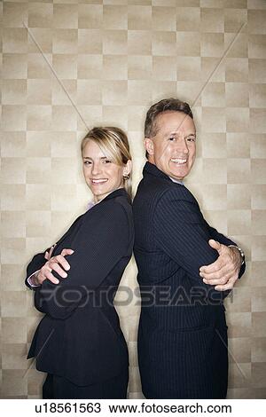 Smiling Business People Back to Back View Large Photo Image Stock Image - Smiling Business People Back to Back. Fotosearch