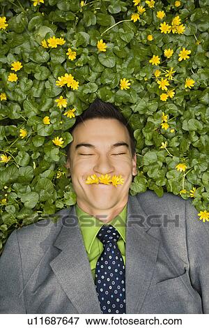 Smiling Businessman in Flower Patch View Large Photo Image Stock Photo - Smiling Businessman in Flower Patch. Fotosearch