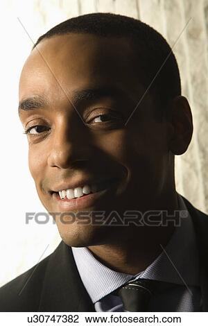 Stock Image - Smiling Businessman Portrait. Fotosearch