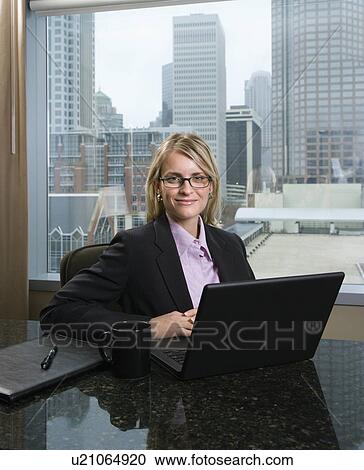 Smiling Businesswoman with Laptop View Large Photo Image Stock Image - Smiling Businesswoman with Laptop. Fotosearch
