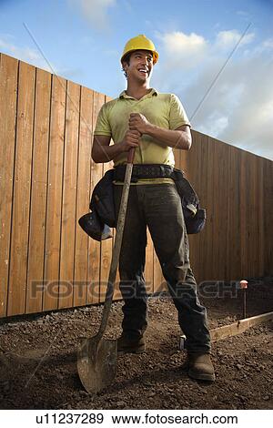Smiling Construction Worker with a Shovel View Large Photo Image Stock Photo - Smiling Construction Worker with a Shovel. Fotosearch