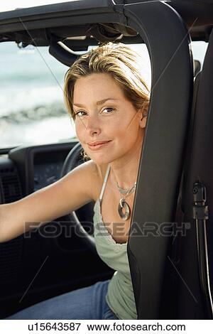 Smiling Woman Sitting in Car View Large Photo Image Stock Photo - Smiling Woman Sitting in Car. Fotosearch