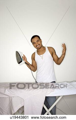 Smiling Young Man Ironing View Large Photo Image Stock Image - Smiling Young Man Ironing. Fotosearch