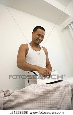 Smiling Young Man Ironing View Large Photo Image Stock Photo - Smiling Young Man Ironing. Fotosearch