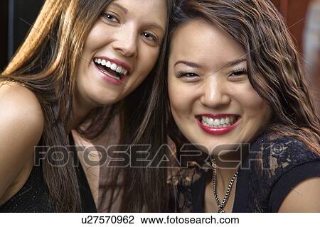 Stock Image - Smiling young women. Fotosearch