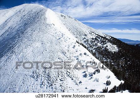 Stock Image - Snowy Mountain Peak. Fotosearch