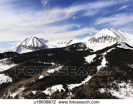 Stock Image - Snowy Mountain Peaks. Fotosearch