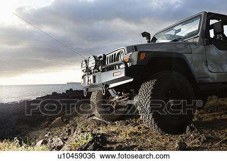 Stock Photograph - SUV at Coast. Fotosearch