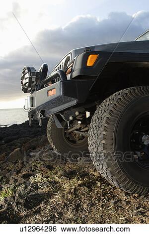 Stock Photograph - SUV at the Coast. Fotosearch