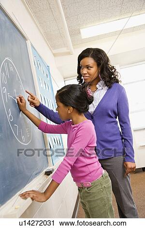 Teacher and Student at Blackboard View Large Photo Image Stock Image - Teacher and Student at Blackboard. Fotosearch