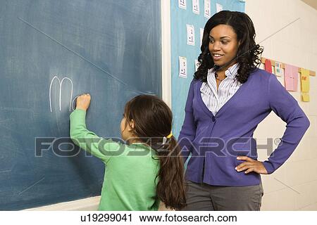 Teacher and Student at Blackboard View Large Photo Image Stock Image - Teacher and Student at Blackboard. Fotosearch