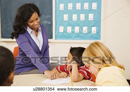 Picture - Teacher Helping Student. Fotosearch