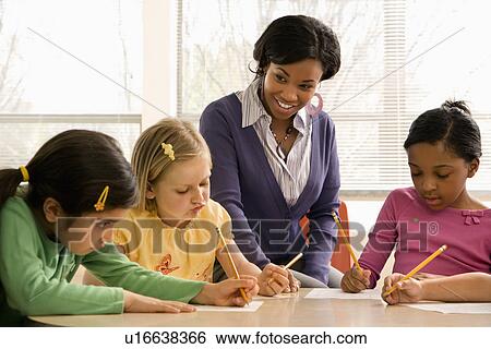 Stock Photograph - Teacher Helping Students. Fotosearch