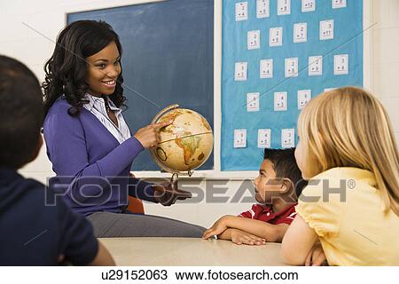 Teacher Holding Globe View Large Photo Image Stock Image - Teacher Holding Globe. Fotosearch
